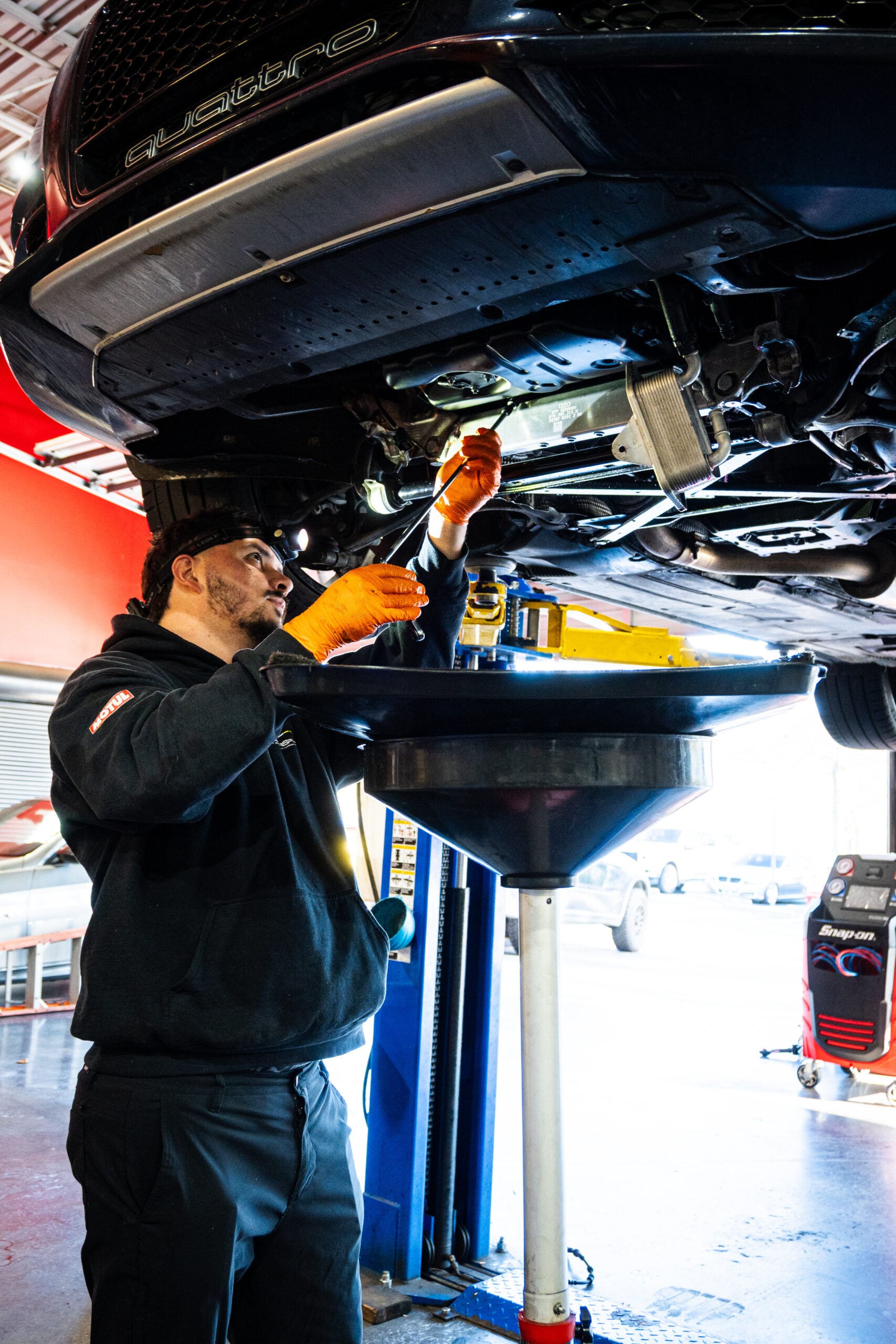Technician Replacing Oil Cooler