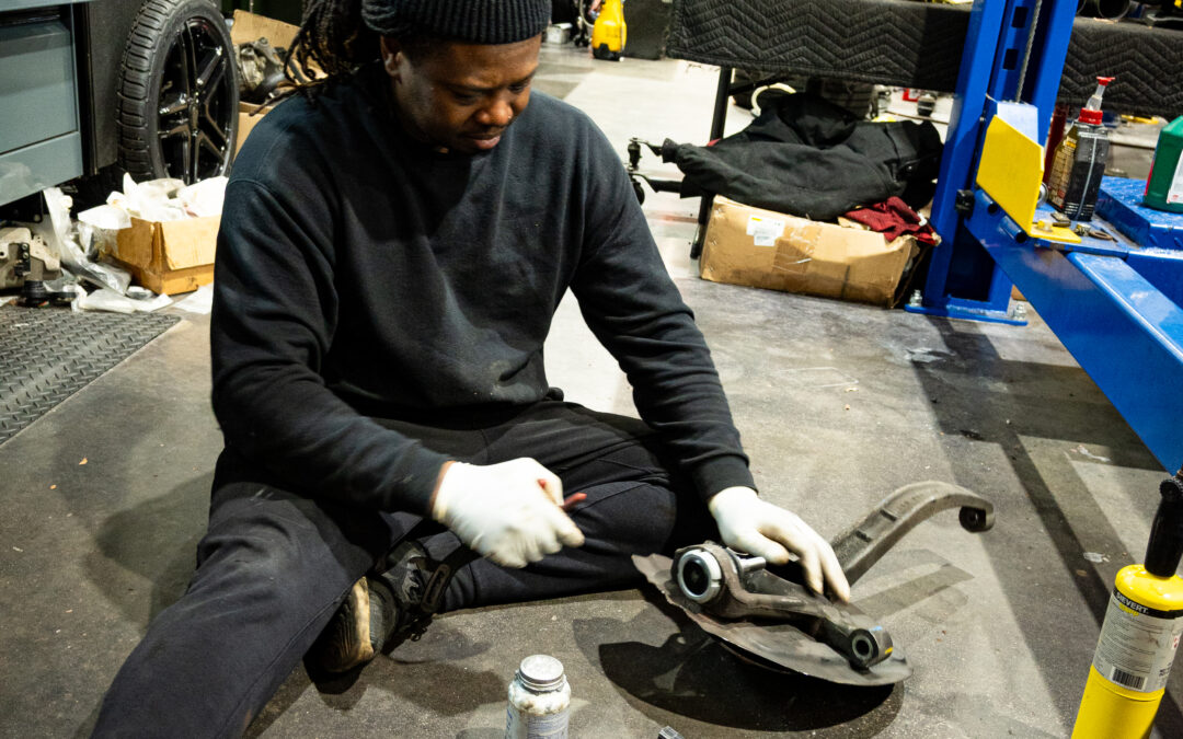 Technician Working on Steering Knuckle