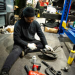 Technician Working on Steering Knuckle