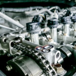 View of a car engine timing belt with other engine components.