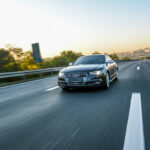 Audi S5 driving on the highway, motion blur.