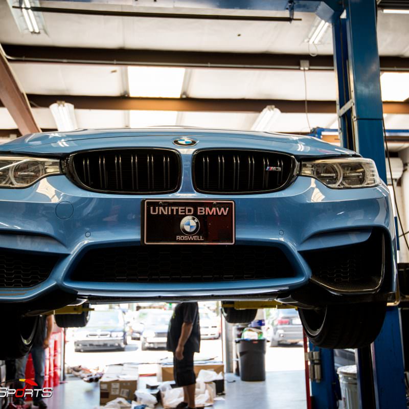 bmw m3 f80 in for akrapovic exhaust and carbon fiber bits, previously installed carbon fiber rearview mirror covers and now were installing carbon fibre diffuser, front splitters and front lip, marina blue m3 looks stunning!