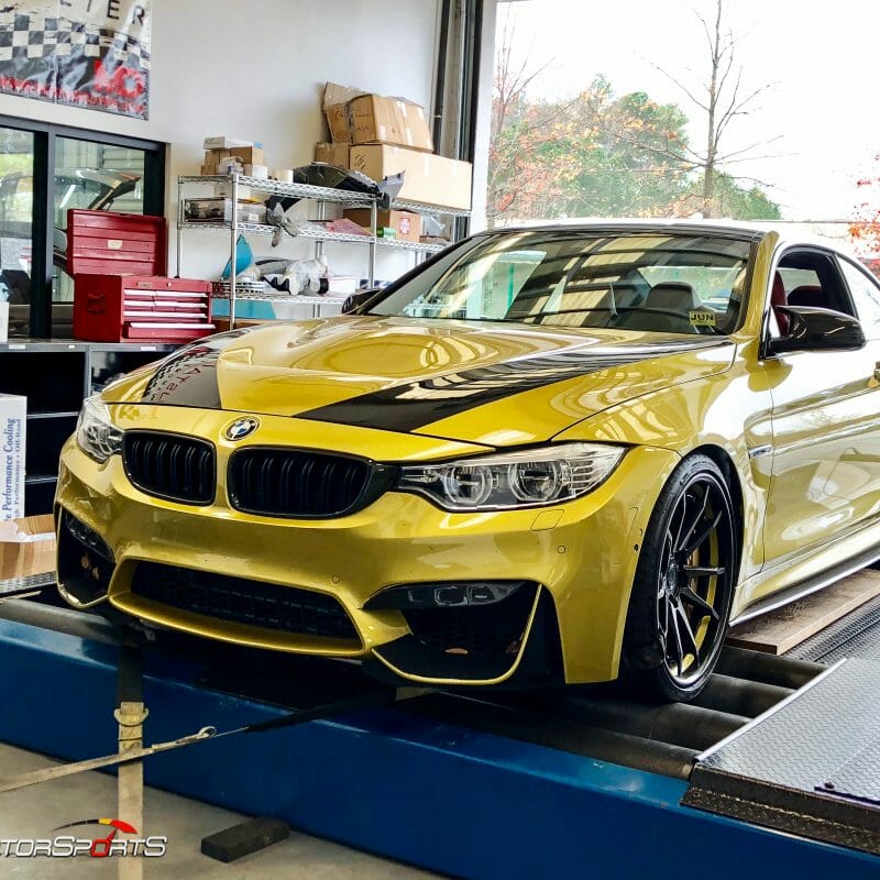 bmw m4 f82 in for power gains downpipes heat exchanger yellow bmw specialists solo motorsports custom tune sms dyno tune downpipes and csf intercooler