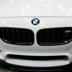 Bmw f10 m5 in for front lip spoiler install. Carbon fibre lip spoiler installed on bmw m5 f10.