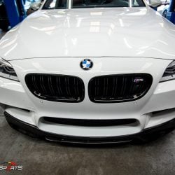 Bmw f10 m5 in for front lip spoiler install. Carbon fibre lip spoiler installed on bmw m5 f10.