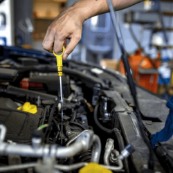 Mechanic Checking Car Oil Level