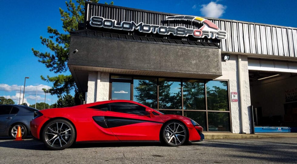 Red Luxury Car Outside Our Garage